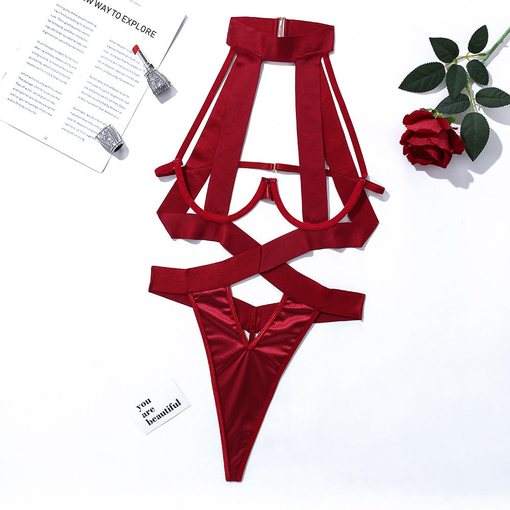 Women's rope and hollow hanging neck jumpsuit lingerie in elegant red color with intricate strap design.