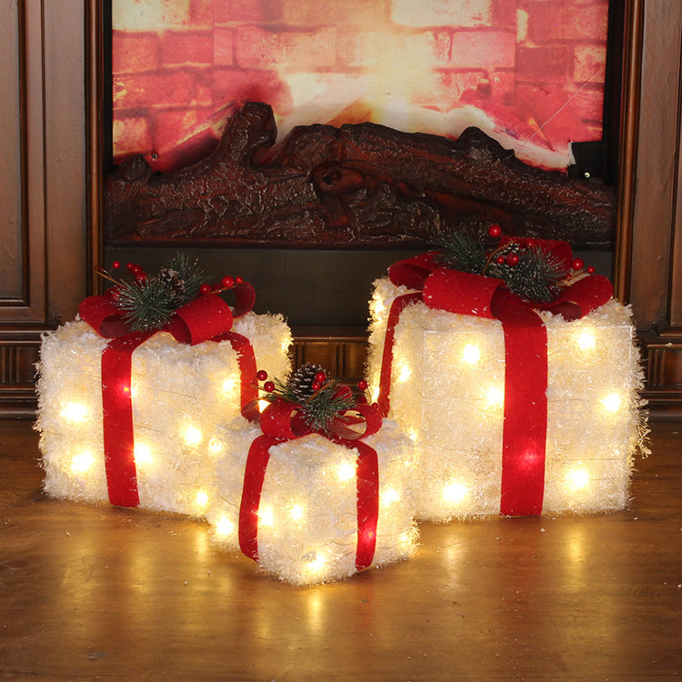 Weihnachtsschmuck mit Lichtern, die weiß leuchten, dreiteilige Geschenkbox, die vertikale Geschenktüten-Szenendekoration