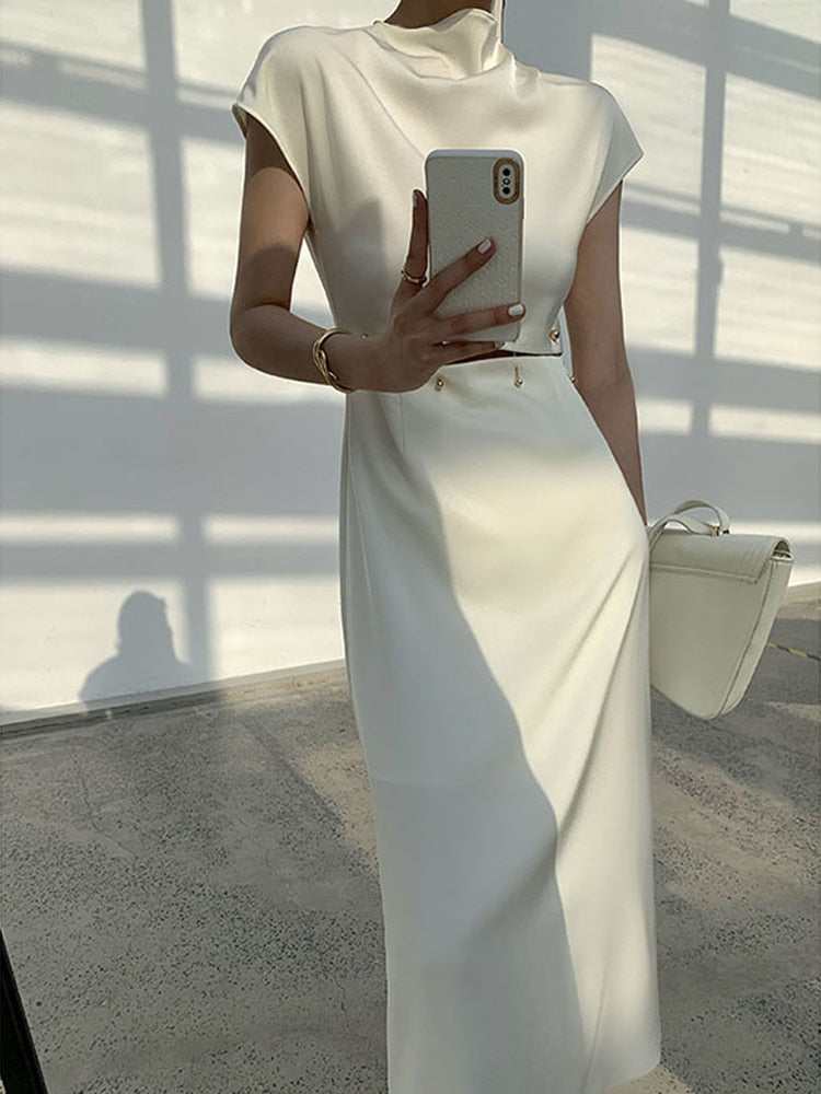 TWOTWINSTYLE Elegant White Long Dress Female Round Neck Short Sleeve High Waist Cut Out Midi Clothing